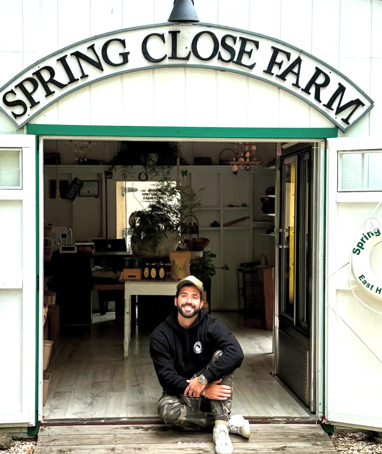 At the farm stand door