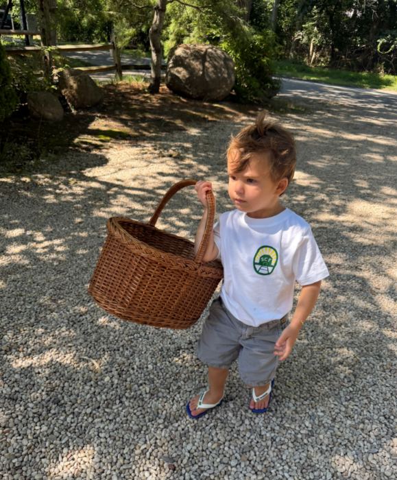 A boy with a harvest basket
