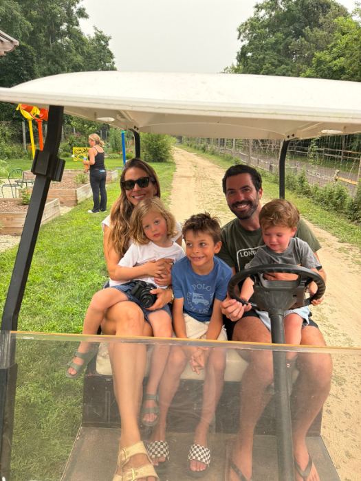 A family with the farm cart