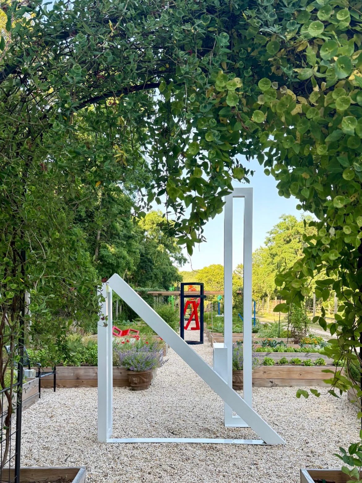 The white sculpture down the gravel path